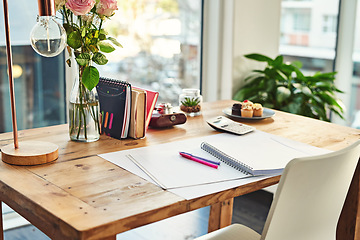 Image showing Book, desk and remote work in creative empty workplace with paper for writing, planning or idea inspiration. Notebook, space and workspace table for freelance business in home office creativity room