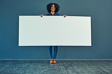 Image showing Banner, mockup and portrait of happy woman in studio with billboard for news, social media or advertising on blue background. Space, paper and girl smile with poster, sign and branding promotion