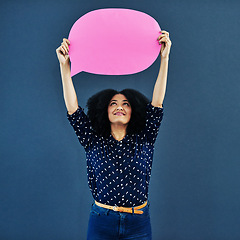 Image showing Speech bubble, mockup and woman in studio with banner for news, social media or advertising on blue background. Space, billboard and female person with paper, poster or branding, launch or promotion