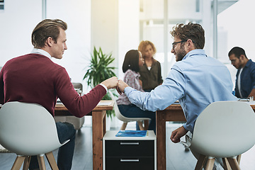 Image showing Friends, collaboration and fist bump with business people in their office, working together on a company project. Motivation, teamwork and congratulations with colleagues celebrating success at work