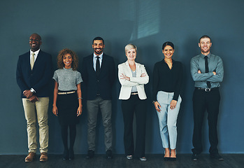 Image showing Happy, smile and portrait of business people in studio for support, advisory and teamwork. Diversity, collaboration and professional lawyer with employees and wall background for legal mission