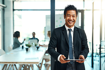 Image showing Office, portrait and asian businessman with tablet or confident, leadership or corporate executive in workplace or management. Man, manager or professional worker or employee with technology