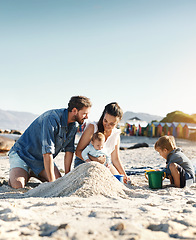 Image showing Sandcastle, holiday and children at the beach with family, love and support. Baby, mom and dad together with kids playing in the sun with happiness and smile by the ocean and mockup with bonding