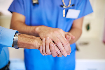 Image showing Care, service and a doctor holding hands with a man for healthcare, help and consulting. Caregiver, cancer and closeup of a nurse with a helping hand for a senior person for medical trust and nursing