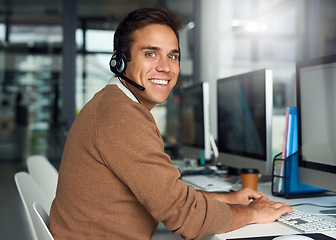 Image showing Customer support, telemarketing and portrait of a man in the office doing online consultation on computer. Technology, contact us and male call center consultant working on crm on a pc in workplace.