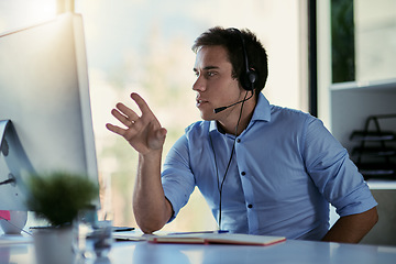 Image showing Help desk agent, office and talking, man consulting with advice, sales information and callcenter career. Phone call, conversation and customer support consultant working and speaking at crm agency.