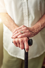 Image showing Hands, cane and closeup of senior woman with disabled injury with balance in retirement in house. Walking stick, elderly lady and person with disability, support or recovery in home with lens flare