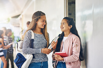 Image showing Girl friends, student talk and school with learning books, study and smile on campus. Teenager, teen and girls with happiness and discussion together with textbook ready to start class and learn