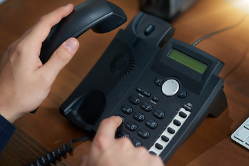 Image showing Hand dial, voip telephone and office for communication, contact us and consulting agent. Telemarketing person, phone call or button on table for customer service, help or tech support on network