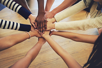 Image showing Circle, group and hands stack with people, teamwork and support for motivation, trust or solidarity by desk. Team, helping hand and together with goal, community and friends with top view by table