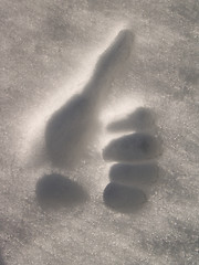 Image showing Success -  Human hand giving thumbs up in the snow