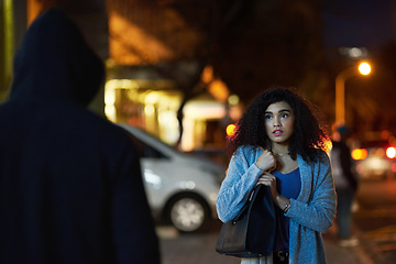 Image showing Danger, woman fear and criminal in the city at night with thief and anxiety outdoor, Urban, dark and female person feeling scared with stress and terror from stalker, crime and risk of scary violence