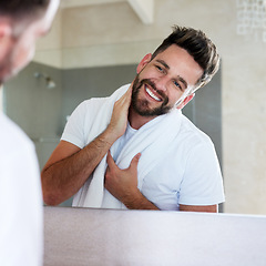 Image showing Grooming, morning and man with cleaning and mirror routine in a bathroom with a smile. Home, reflection and skincare with a young male person feeling happy from beard growth and face dermatology