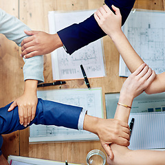 Image showing Business people, hands and join arms in circle, top view and table for support, synergy and mission of success, solidarity and trust. Closeup, integration and collaboration of corporate team building