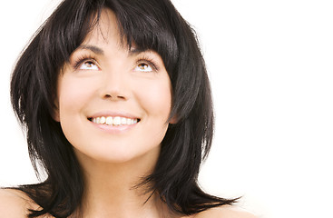 Image showing happy woman looking up over white