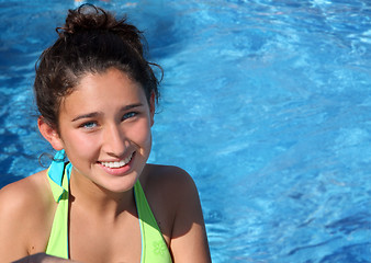 Image showing Pretty teen girl in a pool