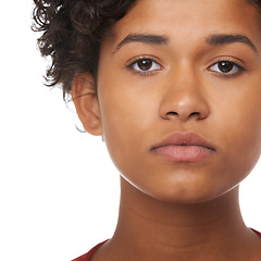 Image showing Young woman, face focus and serious in a studio of a female teenager with white background. Beautiful, Indian teen person and youth portrait feeling focused and concentrating with a girl alone