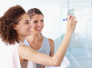 Image showing Happy business woman, coaching and writing for planning, presentation or schedule at the office. Female coach or mentor with smile for project plan, tasks or training staff on whiteboard at workplace