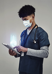 Image showing Man, doctor and digital tablet for global communication or healthcare research with covid mask. Male medical expert on technology for data, networking or hologram against a grey studio background