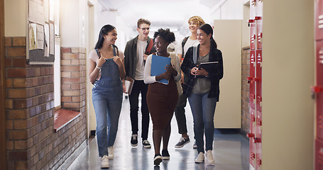 Image showing Happy, school diversity and students in a hallway for education, learning and talking. Smile, conversation and friends speaking while walking to class from a break and studying together as a group