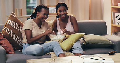 Image showing Movie night, happy and women with popcorn on the sofa for a television show, film or comedy. Smile, relax and African friends on the couch eating food and streaming a subscription service on tv