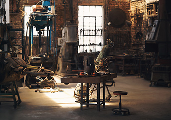 Image showing Foundry, workshop and metal tools on desk for industry, manufacturing and manual labor. Industrial factory, welding workspace and table for steel, iron and production for maintenance craftsmanship