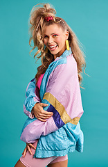 Image showing 80s fashion, retro style and woman portrait with vintage, neon and happiness in a studio. Blue background, female person and jacket of a model with workout, fitness and training outfit with a smile