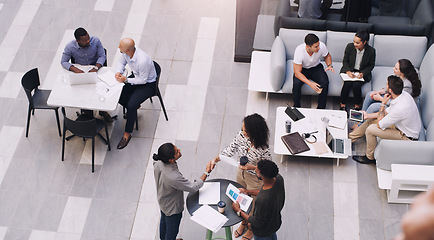 Image showing Top view, businesspeople talking and meeting at a conference at their office space. Diversity at work, communication or collaboration and networking or event planning have a conversation together