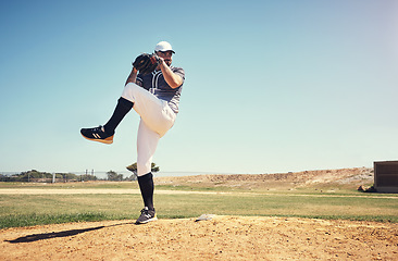 Image showing Pitch, sports and baseball with man on field for competition, training and games. Action, exercise and championship with male athlete throwing in stadium park for fitness, performance and club