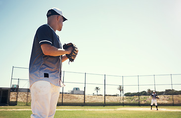 Image showing Pitch, sports and games with man on baseball field for competition, training and performance. Action, exercise and championship with male athlete in stadium park for fitness, practice and club space