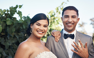 Image showing Wedding, ring and hand with couple in portrait with happiness for celebration in a garden for a ceremony. Marriage, man and woman celebrate their love and commitment in an outdoor event with a smile.