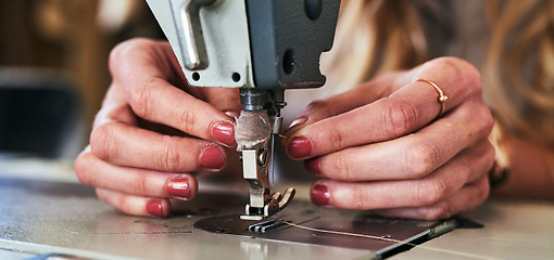 Image showing Workshop sewing machine, woman hands and fashion designer with button and thread work. Small business, entrepreneur and female tailor with boutique and employee working with machinery for clothing