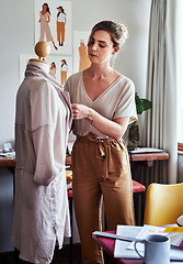 Image showing Fashion, woman and designer with mannequin, working and focus at creative small business in clothing boutique. Design, creativity and tailor with dress on doll for clothes in textile start up studio.