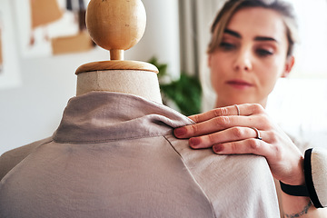 Image showing Fashion, hand of woman and tailor with mannequin, focus and creative small business boutique. Closeup, creativity and designer sewing dress on doll for clothes, working in studio or textile start up.