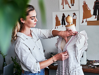 Image showing Fashion, sustainable business and woman designer with mannequin, measuring tape and creative startup. Focus, creativity and tailor with dress on doll, eco friendly design on clothes in textile studio