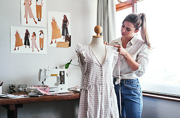 Image showing Fashion, design and woman with mannequin, measuring tape and sewing machine at creative small business. Focus, creativity and tailor with dress on doll for clothes, designer in textile startup studio