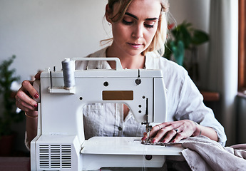 Image showing Fashion, woman and textile designer at sewing machine, sustainable business with creative ideas and focus. Creativity, start up and design, or tailor at table stitching fabric, entrepreneur at work.