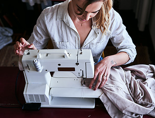 Image showing Fashion, design and woman at sewing machine from above, small business with creative ideas and focus at workshop. Creativity, textile start up and designer, tailor or entrepreneur at table stitching.