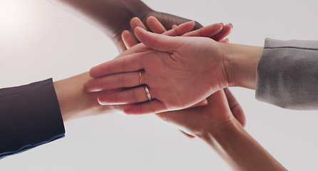 Image showing Business people, teamwork and group hands for support from below with solidarity, trust and collaboration. Professional team building, partnership and strategy of men and women with motivation