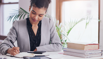 Image showing Business woman, calculator and writing in notebook on desk for finance budget, accounting or planning. Female admin accountant with books, pen and list for tax on financial profit or income in office