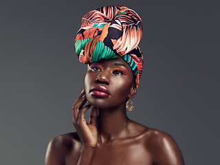 Image showing Makeup, beauty and face of black woman in studio on gray background with glamour, cosmetics and luxury. Fashion, thinking and serious female person in exotic jewelry, African style and head scarf