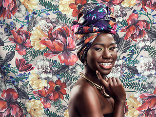 Image showing Makeup, fashion and portrait of black woman on flower background with glamour, cosmetics and fashion. Floral pattern, happy and face of female person in exotic jewelry, African style and head scarf