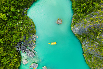 Image showing Nature, drone and boat on sea with greenery on a tropical island at summer vacation travel. Environment, lake water and aerial view of outdoor river with forestry mountains and plants in environment.