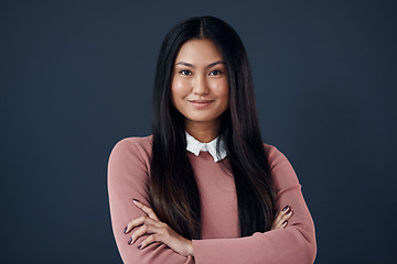 Image showing Smile, portrait of Korean woman with arms crossed and on a dark background. Empowerment or confident, professional corporate worker and pose with happy young businesswoman in a studio backdrop.