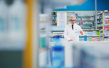 Image showing Pharmacy product, senior man and pharmacist reading pharmaceutical, supplements or pills package info. Typing, drug store medicine and medical person research supplement prescription information