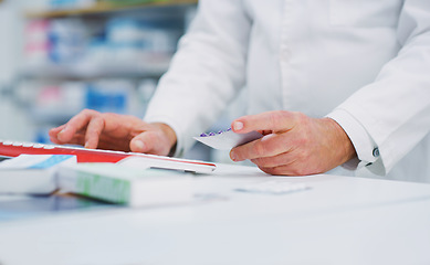 Image showing Pharmacy pills, computer keyboard and person hands typing, research and search product info on drugs store database. Dispensary service, hospital medicine and chemist enter supplement information