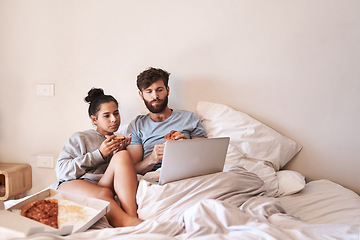 Image showing Hungry couple, pizza and movie on laptop in bed with junk food and streaming series. Eating, computer video and meal in a bedroom at home with man and woman with bonding, online watching and mockup