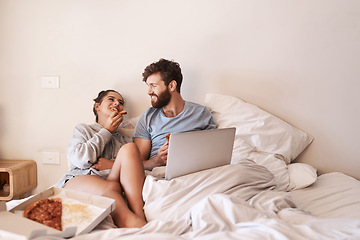 Image showing Couple laugh, pizza and movie on laptop in bed with junk food and streaming series. Eating, computer video and meal in a bedroom at home with man and woman together with bonding and online watching