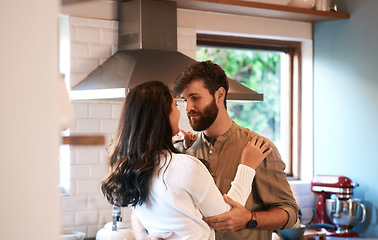 Image showing Young couple, dance and kitchen in home with love, passion and cooking together for romance, care or bond. Man, woman and hug with dancing, moving and connection for food, nutrition or diet in house