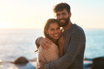 Image showing Love, beach and portrait of couple hug for relaxing, bonding and quality time on romantic date. Nature, travel and man and woman embrace for anniversary or honeymoon on holiday, weekend and vacation